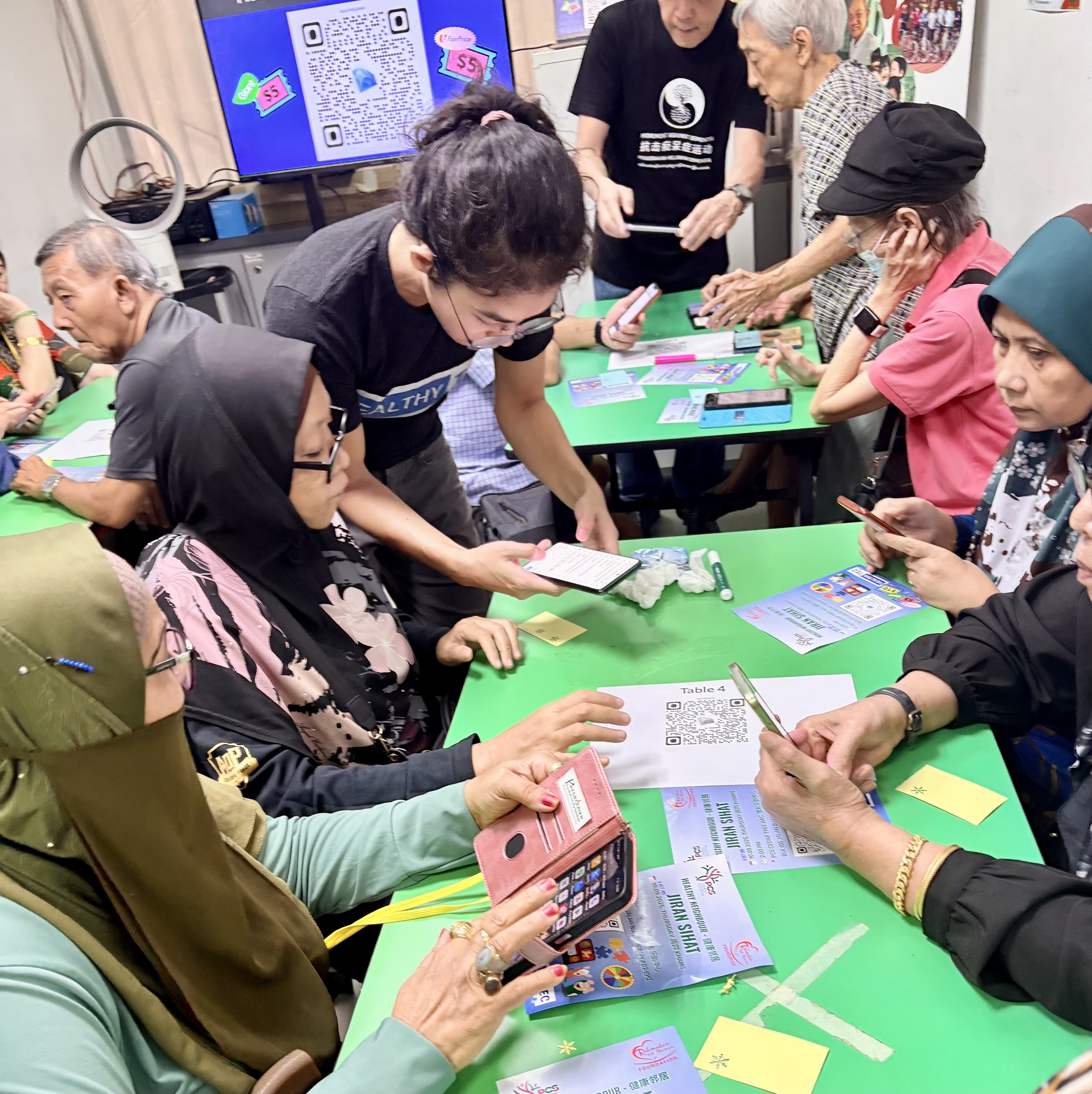 Seniors playing a table game together at an Active Ageing Centre